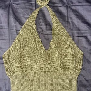 I am selling a knitted crop top. You can tie it by the neck and it’s comfortable